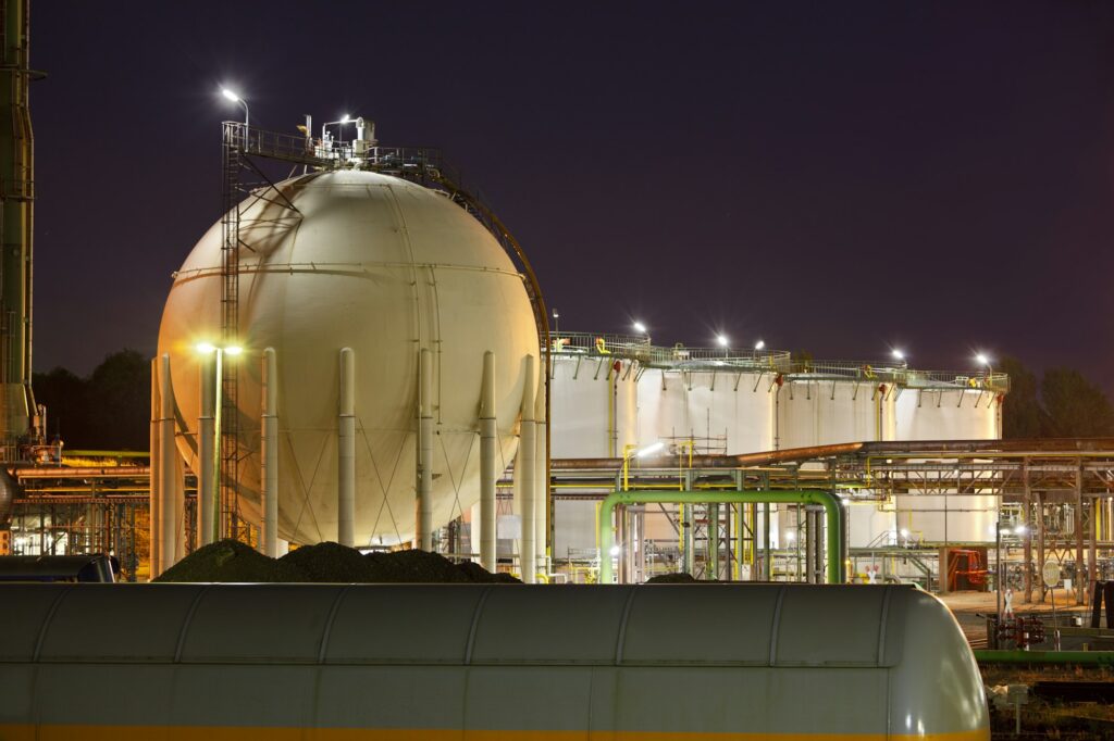 Oil And Gas Storage Tanks At Night